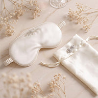 Ivory Lullaby silk eye mask and pouch set flat lay