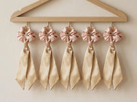 Boutique display of Gala Blush Duet silk scrunchies