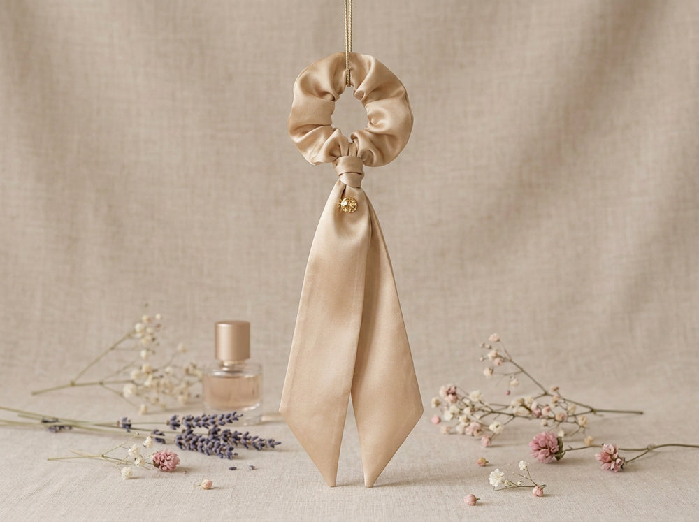 Golden Hour champagne silk scrunchie with ribbon tails - vertical lifestyle