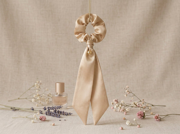 Golden Hour champagne silk scrunchie with ribbon tails - vertical lifestyle