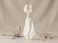 Gala ivory silk scrunchie with crystal below knot - vertical lifestyle
