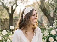 Bride laughing in ivory silk bandana